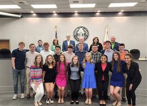 Leadership Hewitt Trussville students with Trussville City Council members in the City Council Chambers posing for photo
